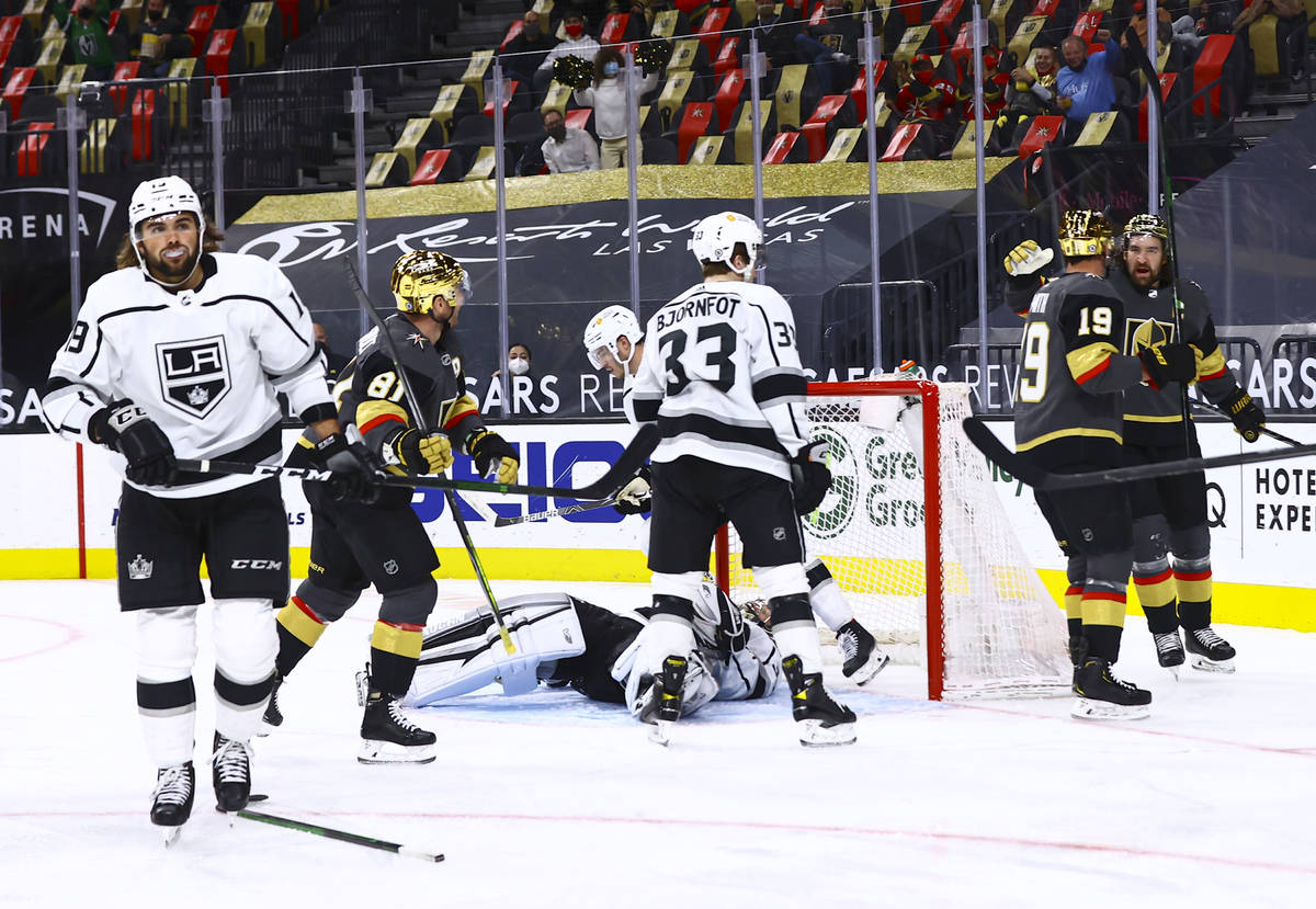 Golden Knights' Reilly Smith (19) celebrates his goal with Mark Stone, right, during the second ...