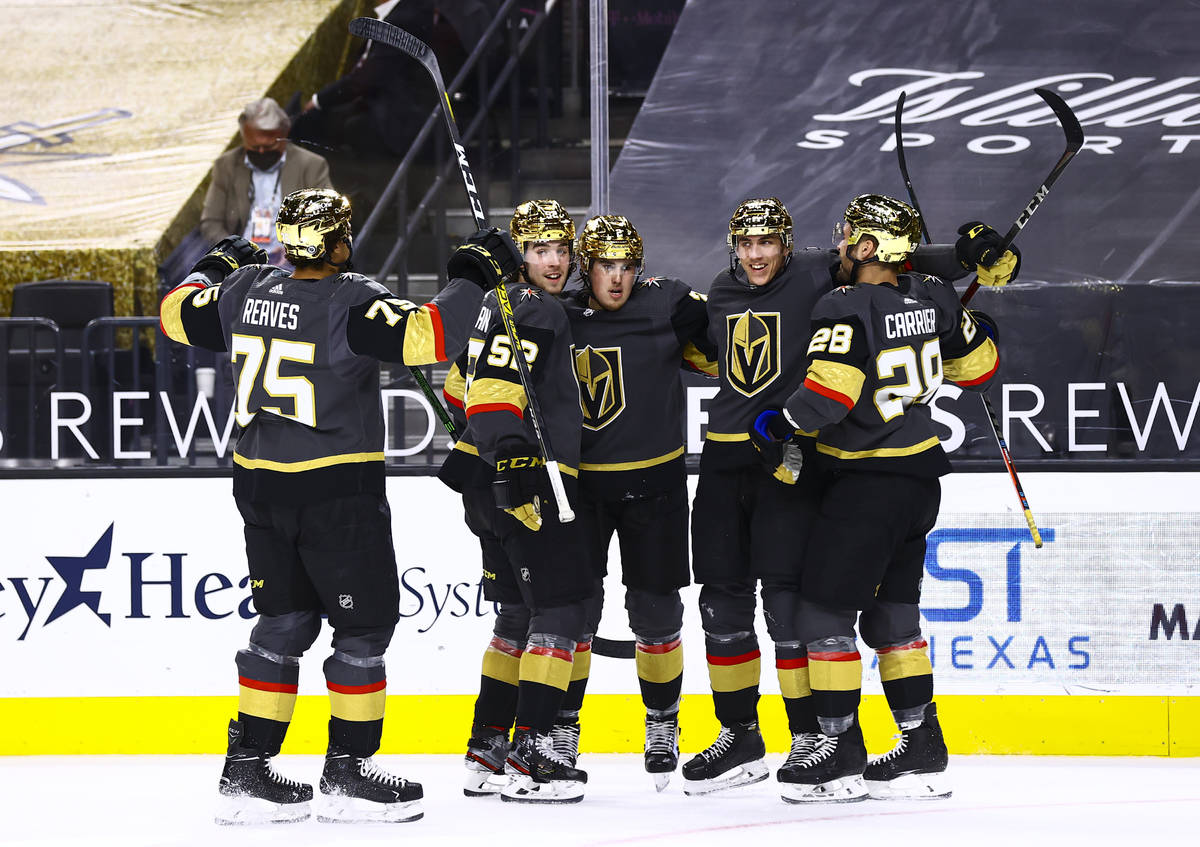 Golden Knights' Tomas Nosek, second from right, celebrates his goal with teammates during the s ...
