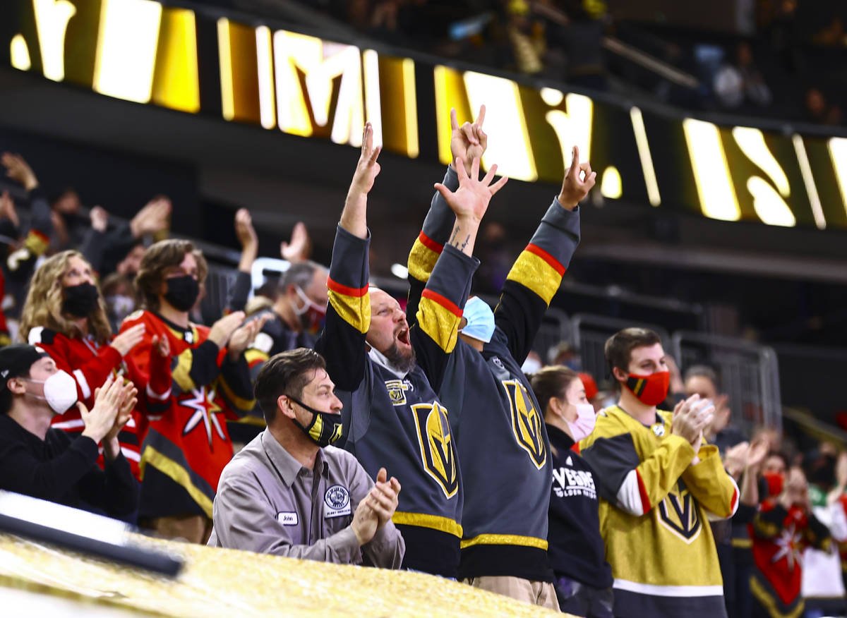 Golden Knights fans celebrate a goal by Tomas Nosek, not pictured, during the second period of ...