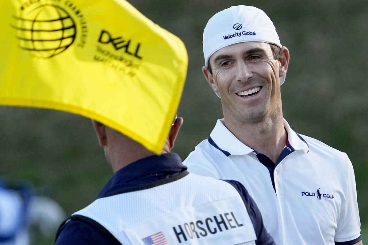 Billy Horschel is congratulated by his caddie on the 17th green after Horschel won the Dell Tec ...