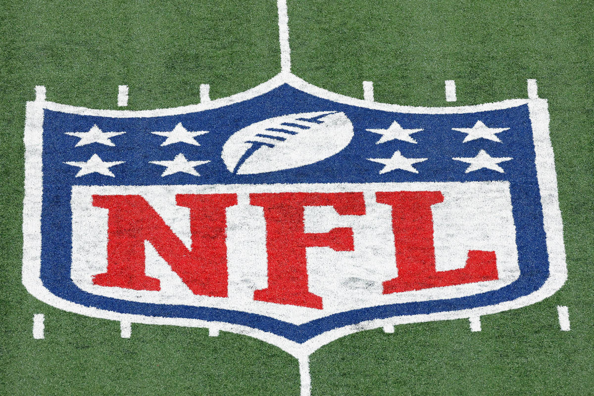 FILE - In this Nov. 2, 2020, file photo, the NFL logo is displayed at midfield during an NFL f ...
