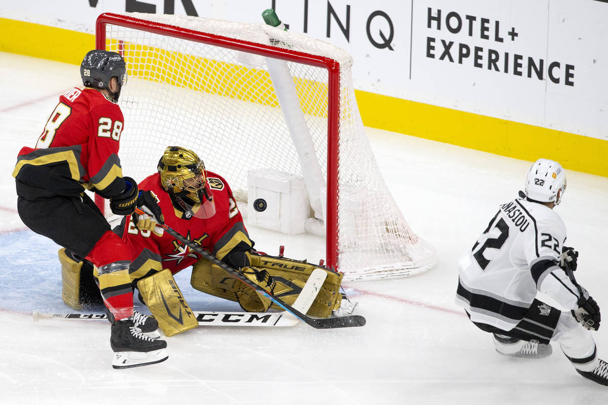 Kings left wing Andreas Athanasiou (22) shoots a goal while Golden Knights goaltender Marc-Andr ...