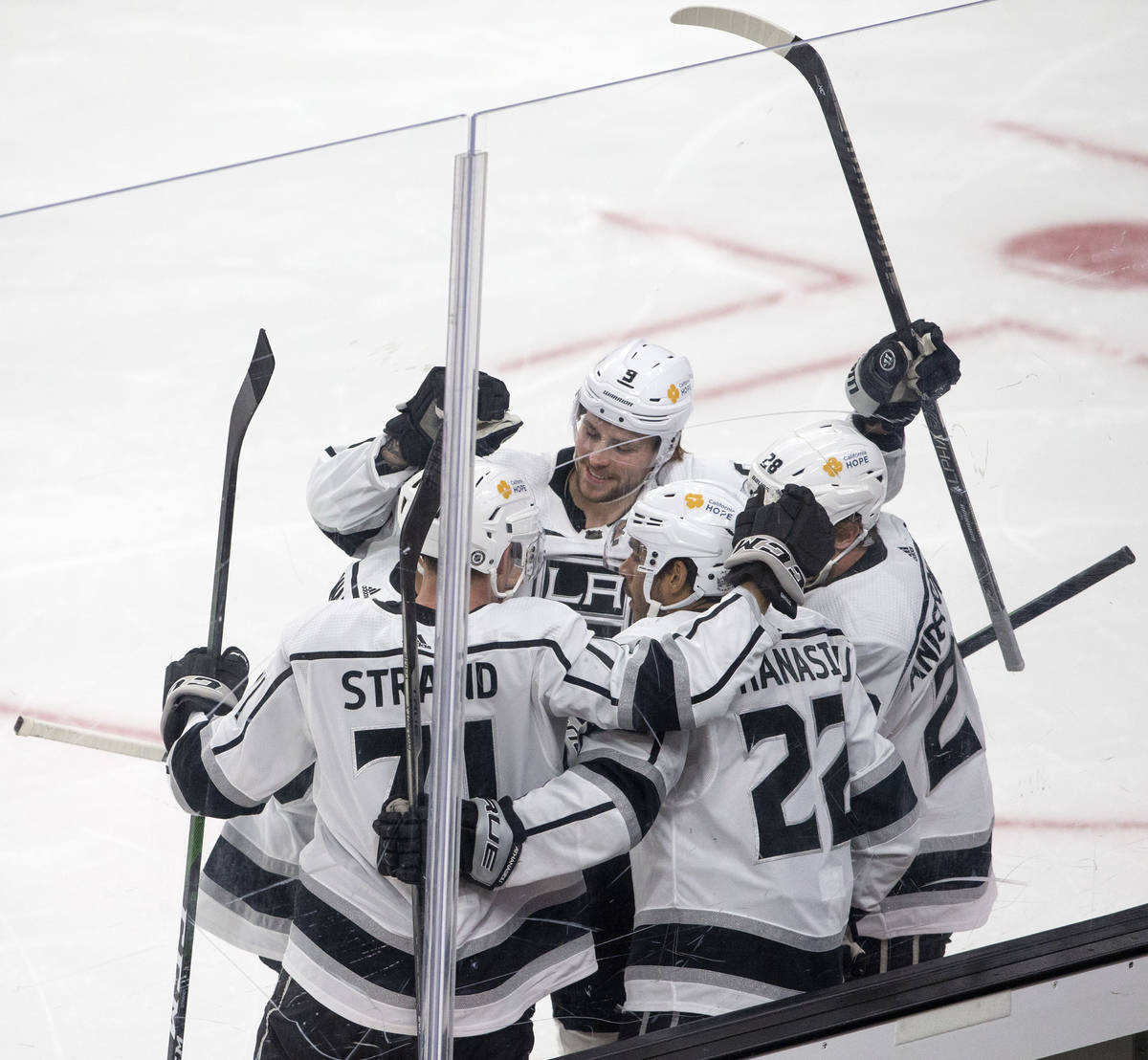 The Kings celebrate a point scored by left wing Andreas Athanasiou (22) during the first period ...