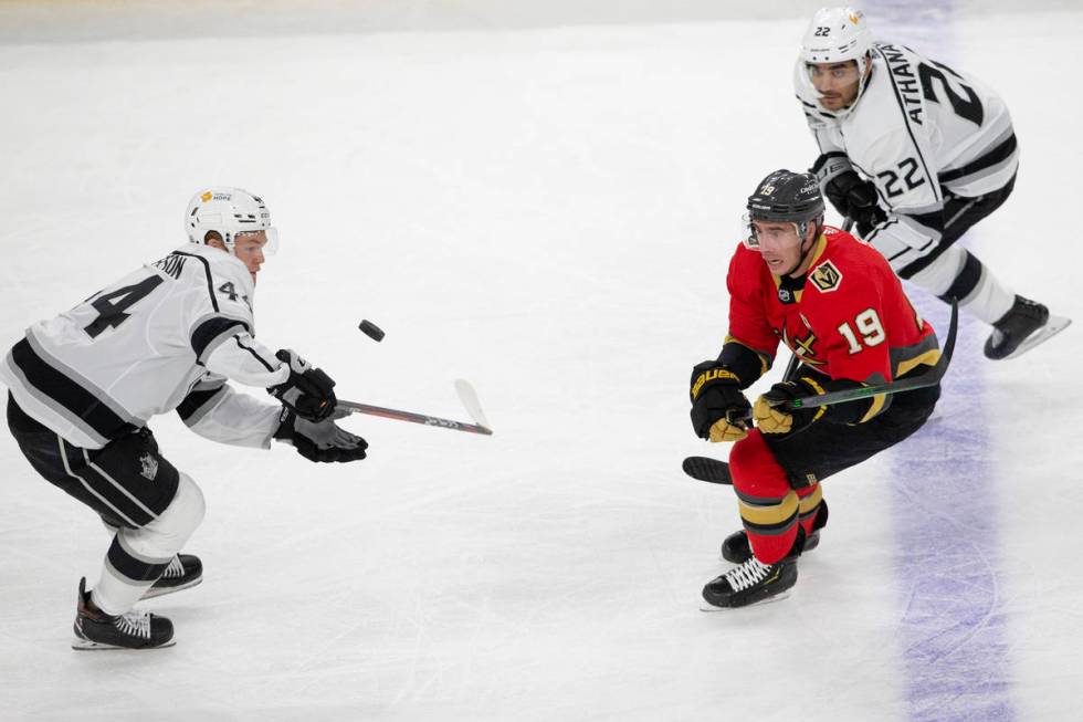 Golden Knights right wing Reilly Smith (19) and Kings left wing Andreas Athanasiou (22) eye the ...