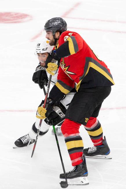 Golden Knights right wing Alex Tuch (89) and Kings right wing Alex Iafallo (19) make contact du ...