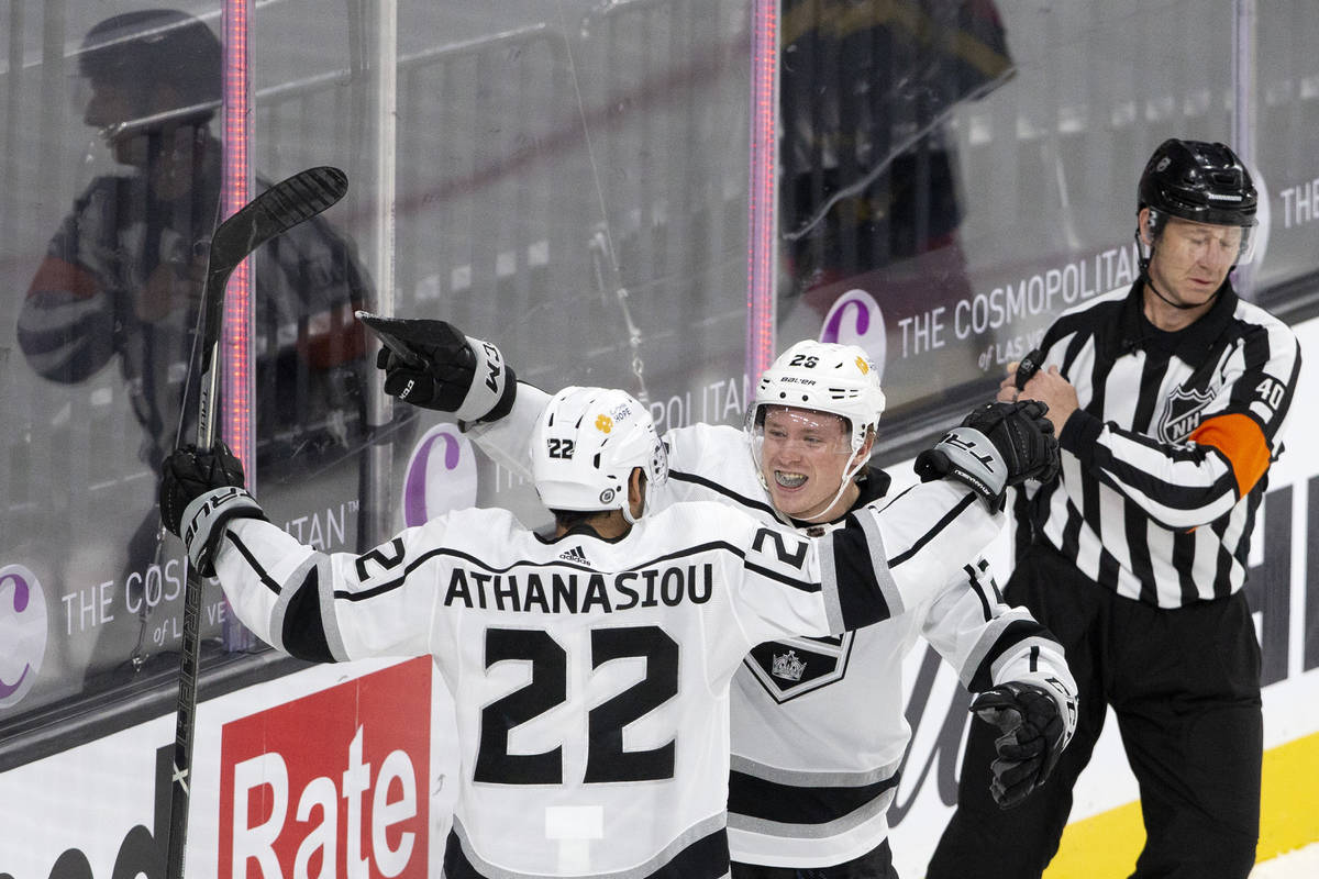Kings left wing Andreas Athanasiou (22) and center Jaret Anderson-Dolan (28) elebrate a goal sc ...