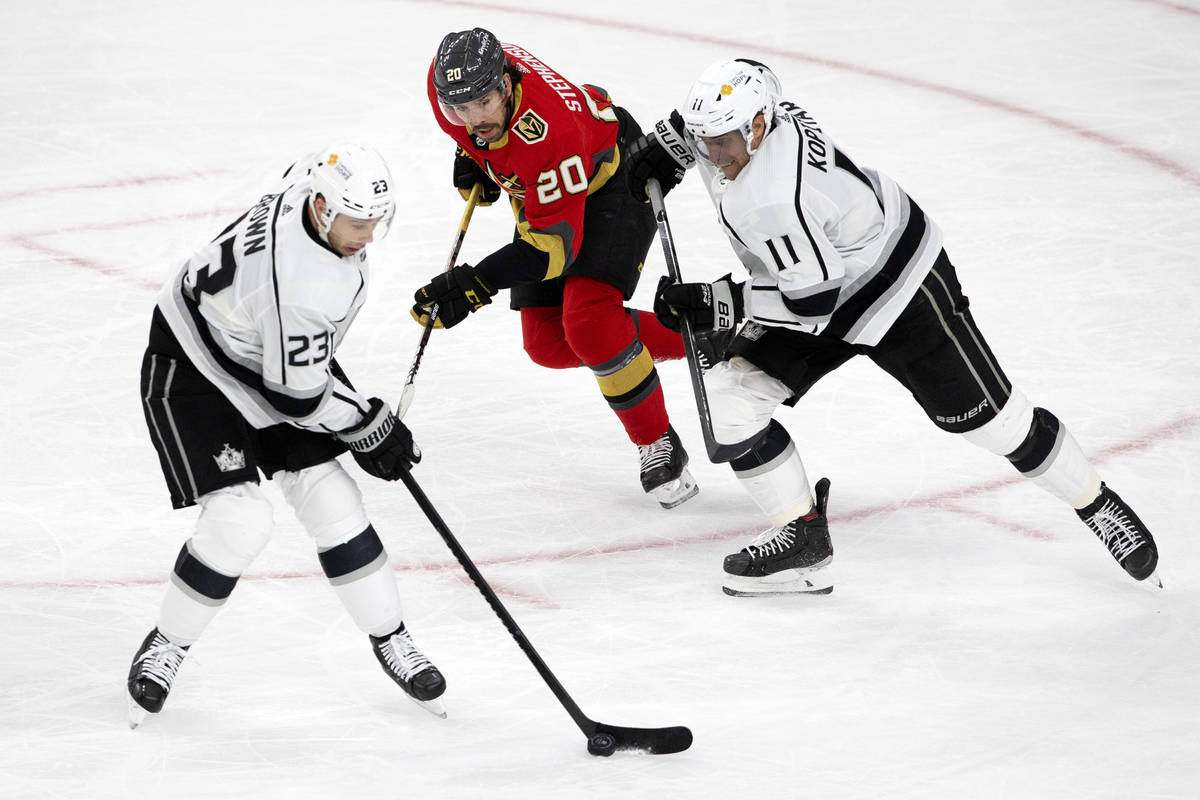Kings right wing Dustin Brown (23), Golden Knights center Chandler Stephenson (20) and Kings ce ...