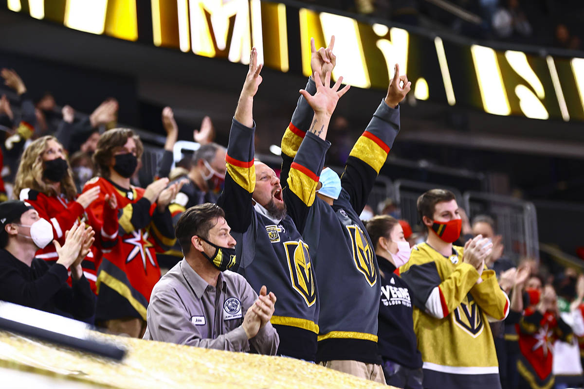 Golden Knights fans celebrate a goal by Tomas Nosek, not pictured, during the second period of ...