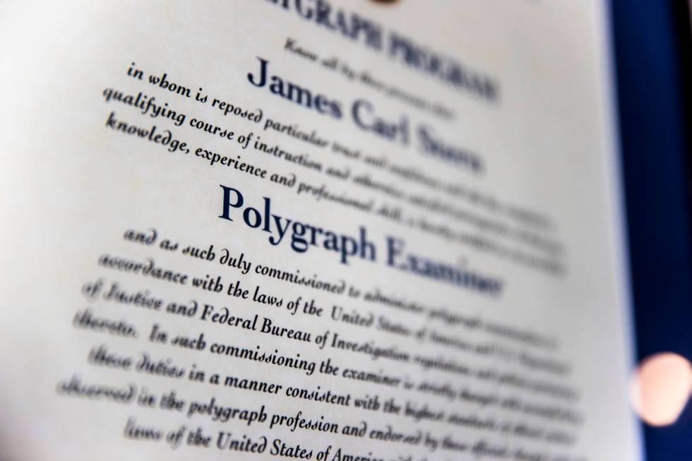 Retired FBI agent Jim SternÕs framed polygraph examiners certification at his home in Las ...