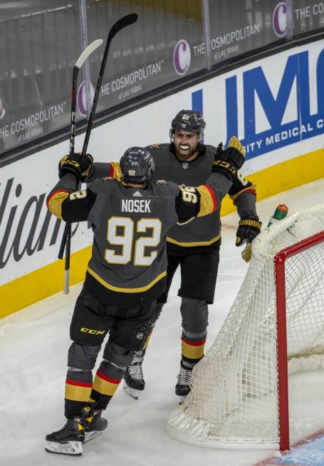 Golden Knights right wing Alex Tuch (89) and left wing Tomas Nosek (92) celebrate a goal during ...