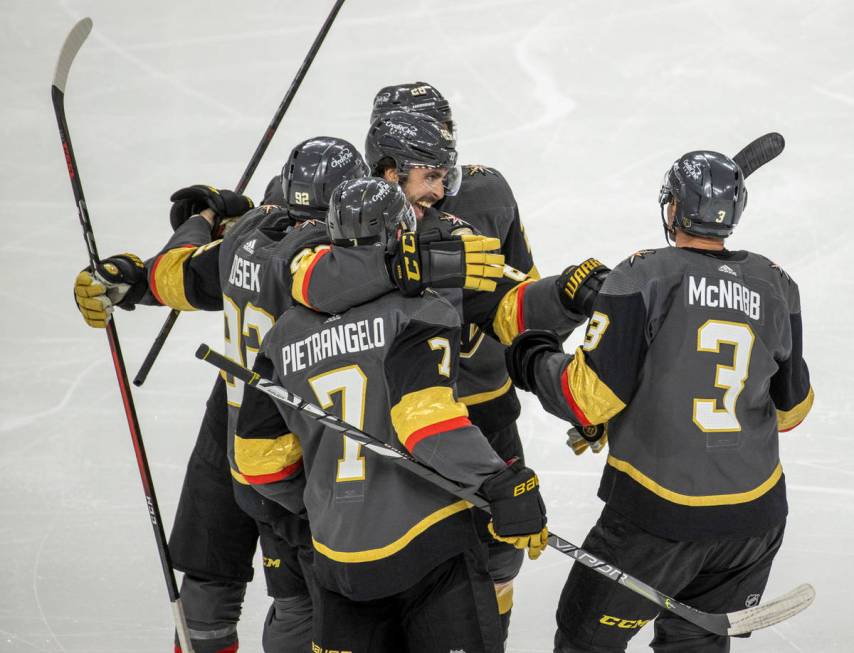 Golden Knights players celebrate a goal over the Minnesota Wild during the third period of an N ...
