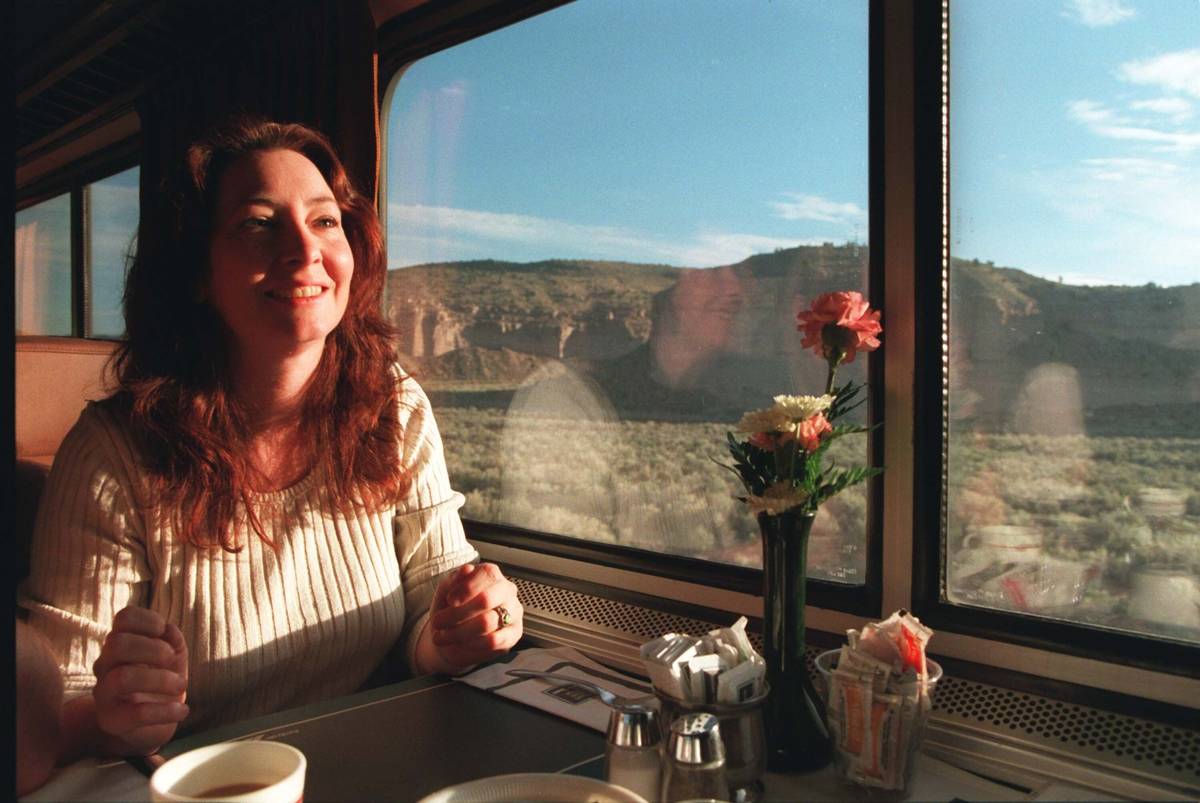 Scianna Augustine, a travel agent from Las Vega,s has her morning coffee as the Amtrak's Desert ...