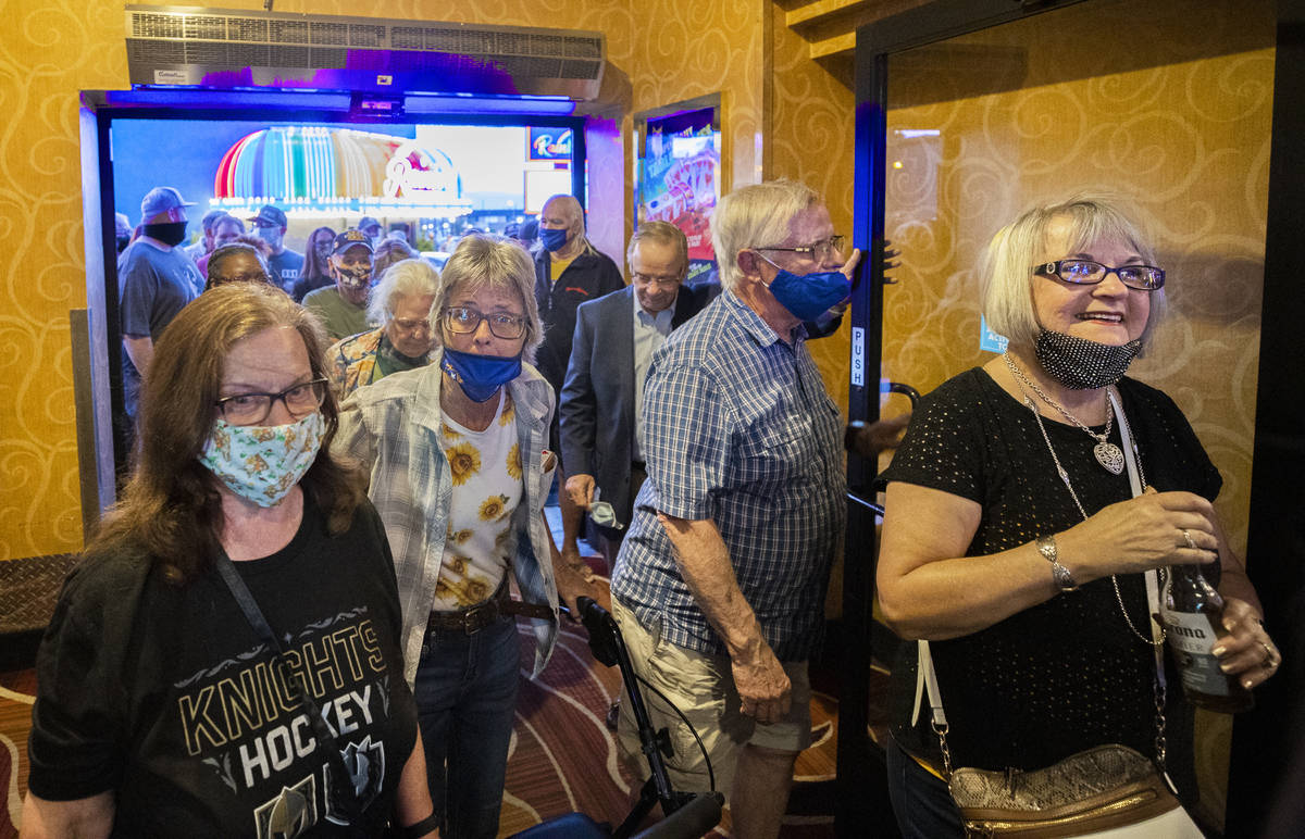 Crowds flood into The Pass casino during opening night in Henderson on Thursday, April 1, 2021. ...
