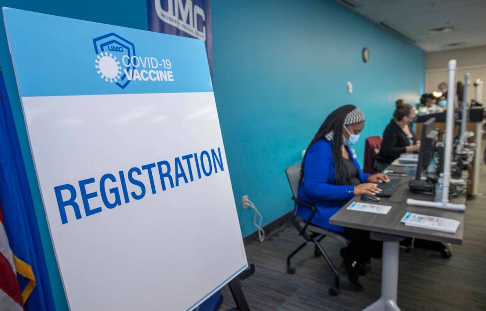 Registration table as University Medical Center front-line health care workers receive their Pf ...