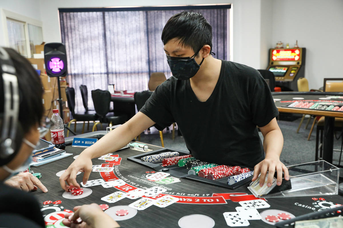 Marvin Ly practices dealing blackjack at the CEG Dealer School in Las Vegas, Thursday, April 1, ...