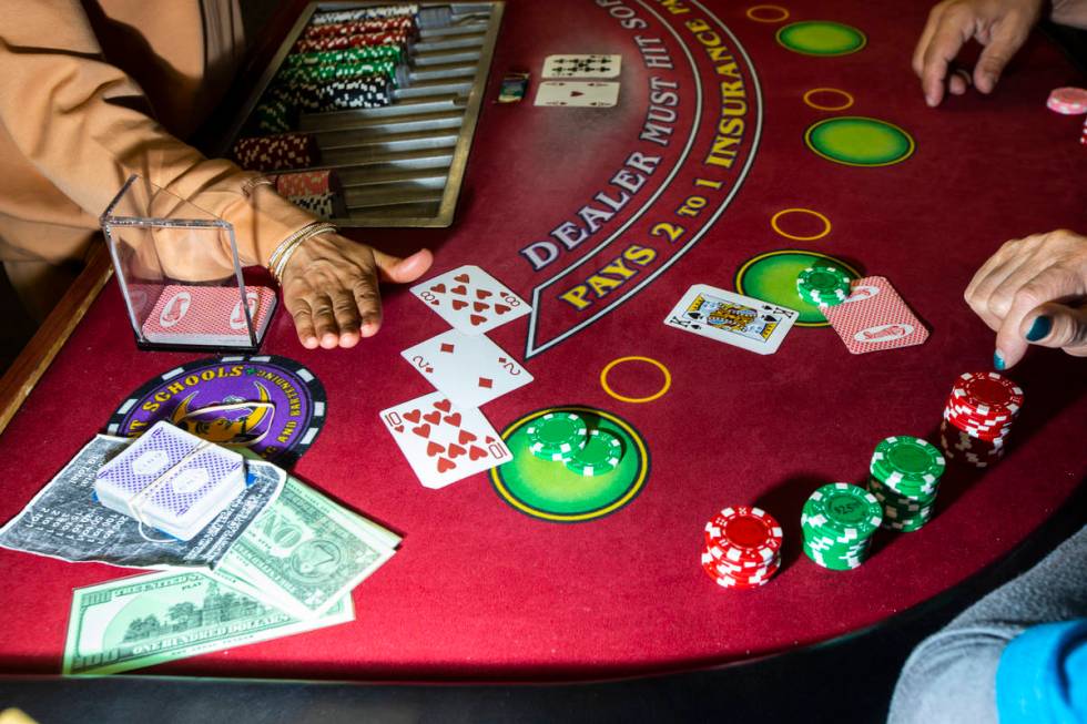 Instructor Yodit Girma works a blackjack table during class at the Crescent School of Gaming an ...