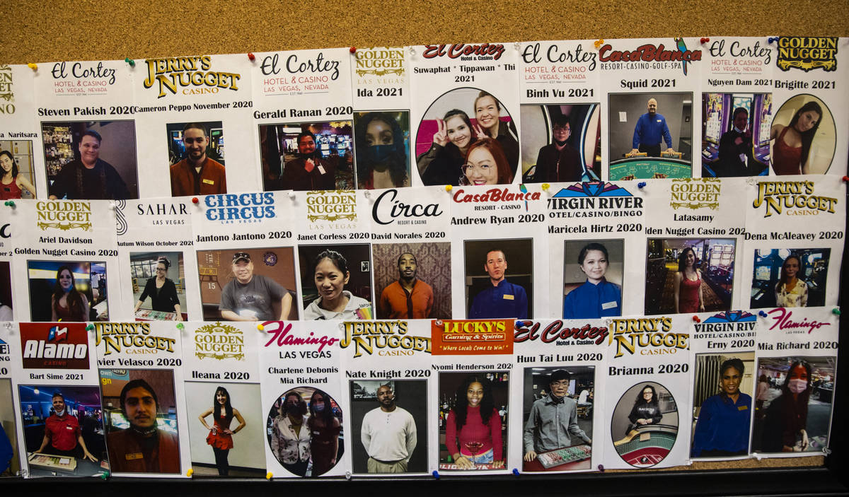 A wall displays pictures of students who have graduated at the Crescent School of Gaming and Ba ...