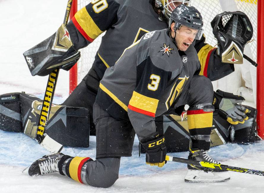 Golden Knights defenseman Brayden McNabb (3) takes a puck to the shin while defending the net w ...