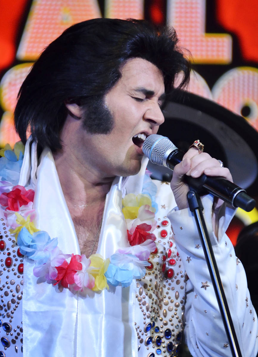 Travis Allen performs as Elvis Presley during "All Shook Up" at the V Theater in the Miracle Mi ...