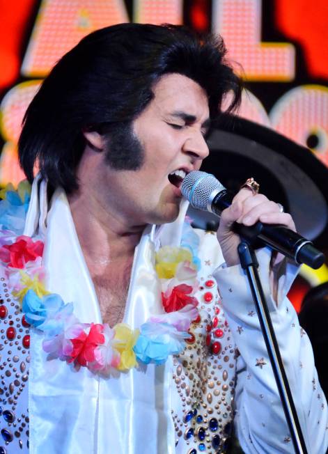 Travis Allen performs as Elvis Presley during "All Shook Up" at the V Theater in the Miracle Mi ...