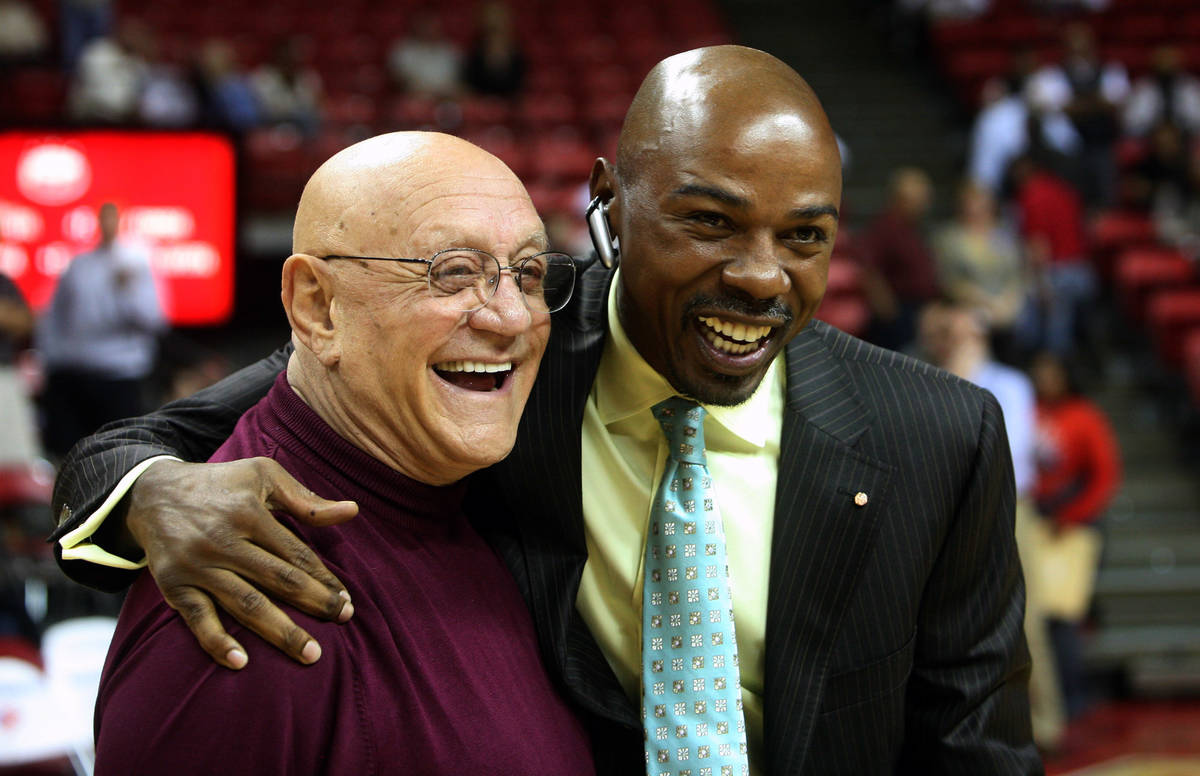 Former Las Vegas basketball coach Jerry Tarkanian, left, greets former player Greg Anthony, rig ...