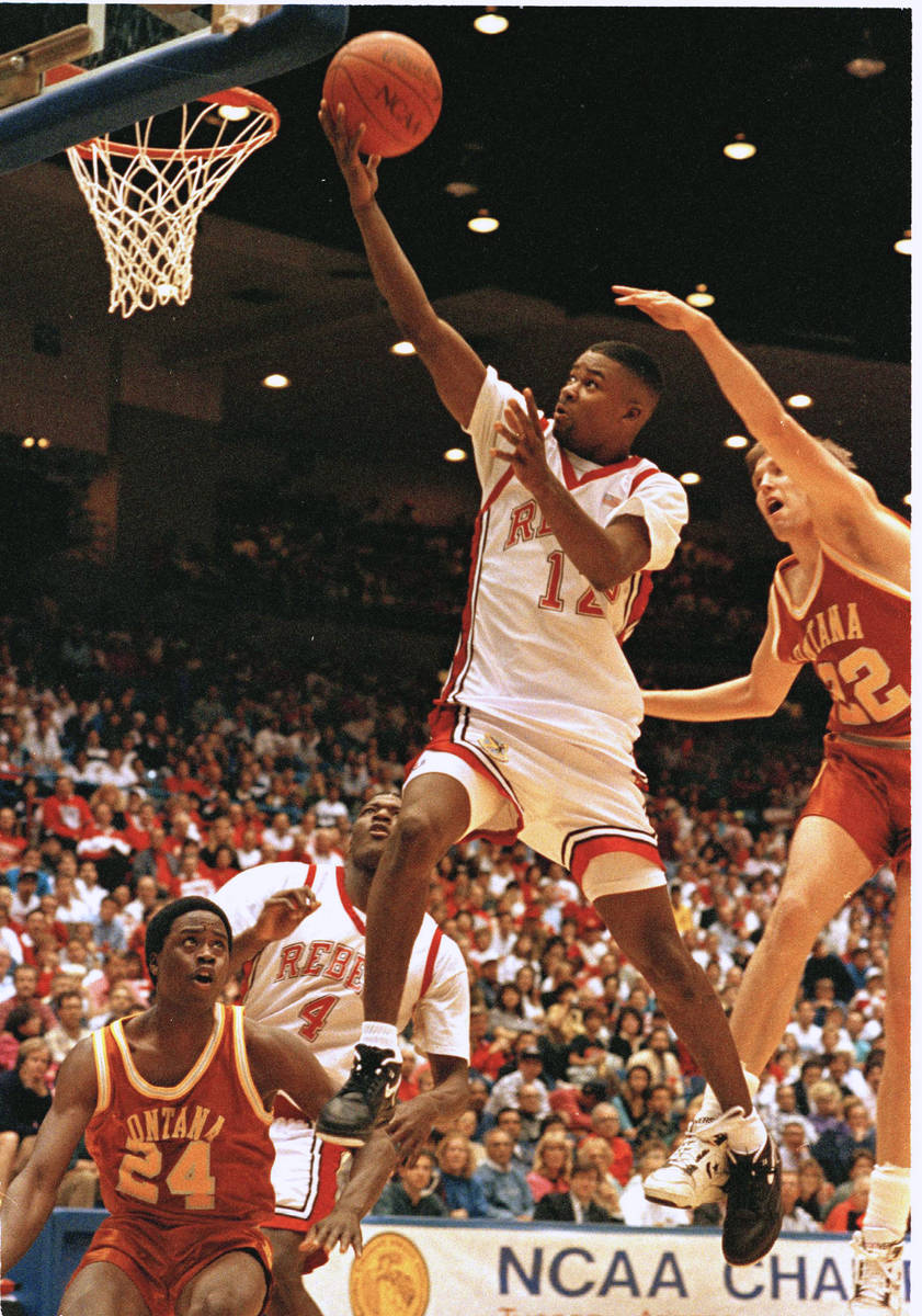 FILE - In this March 16, 1991, file photo, UNLV's guard Anderson Hunt goes past Montana's Roger ...