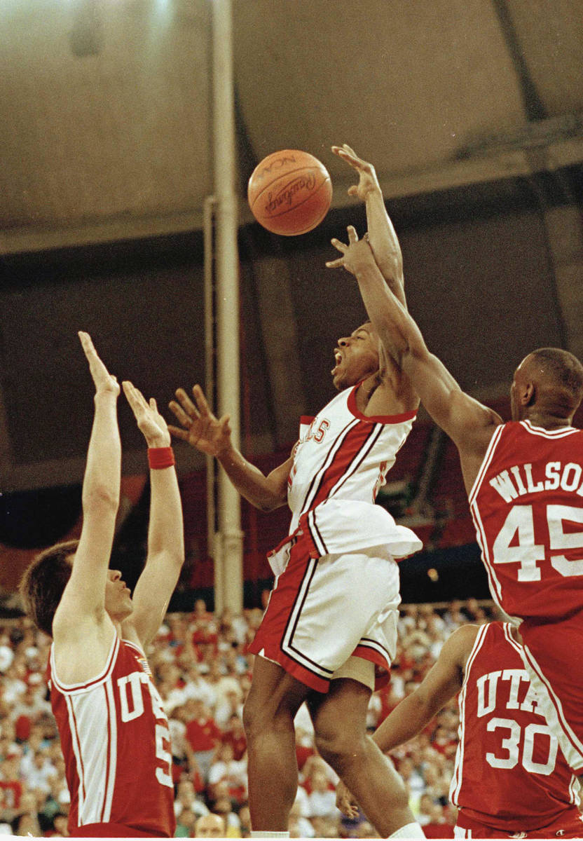 UNLV's Greg Anthony (50) goes to the basket between Utah's Josh Grant (5) and Byron Wilson (45) ...
