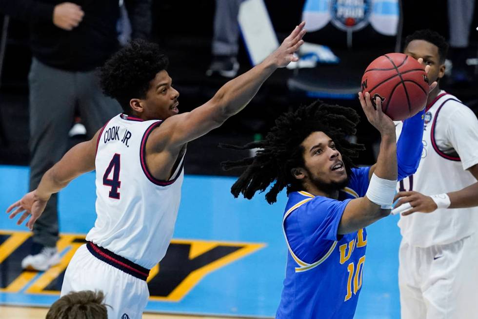 UCLA guard Tyger Campbell (10) shoots ahead of Gonzaga guard Aaron Cook (4) during the second h ...