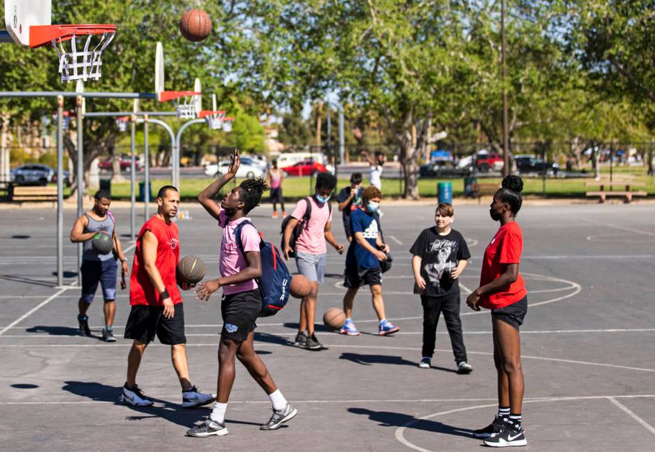 Players shoot around at Sunset Park on Saturday, April 3, 2021, in Las Vegas. The backboards we ...