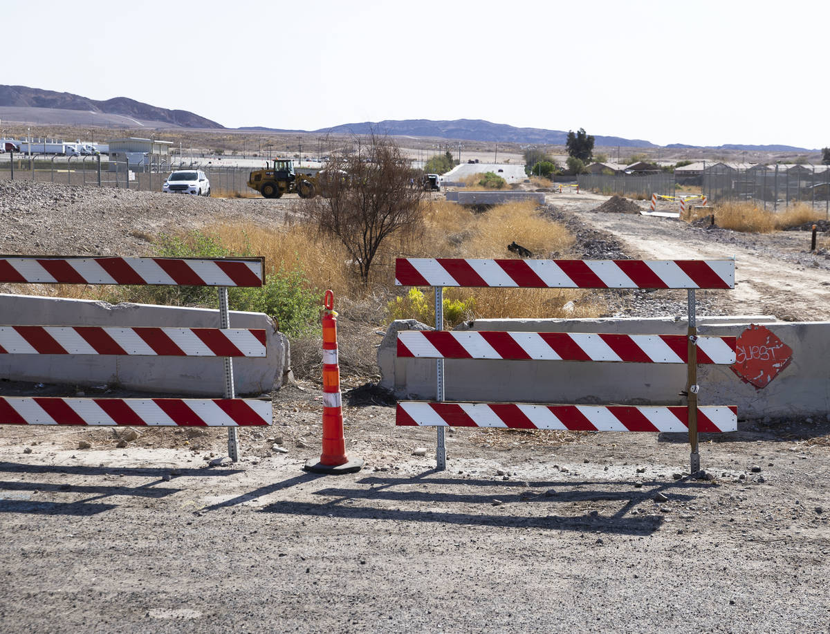 Traffic barricades are seen at the intersection of Desert Inn and Theme Road, on Monday, April ...