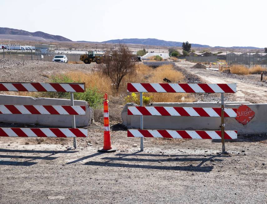 Traffic barricades are seen at the intersection of Desert Inn and Theme Road, on Monday, April ...