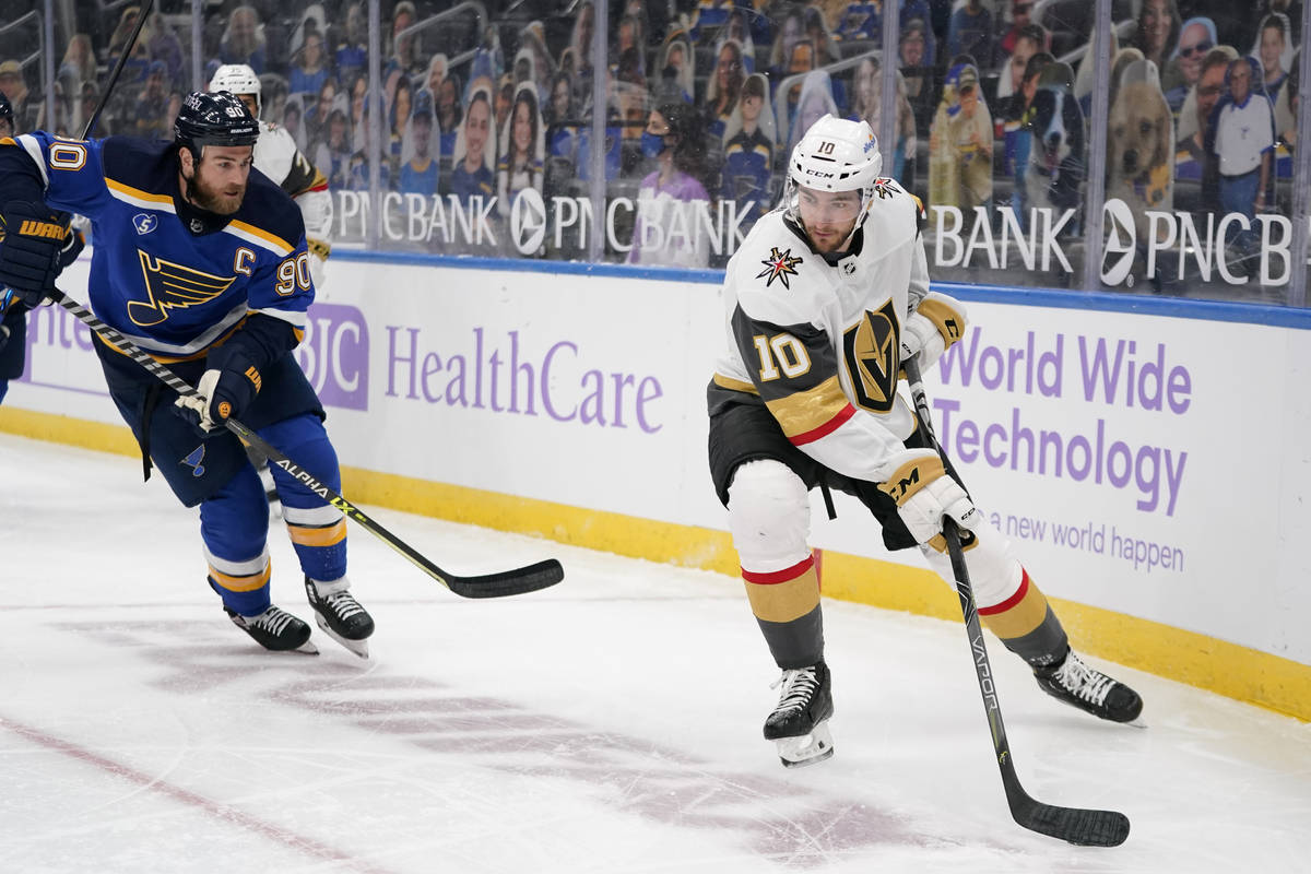 Vegas Golden Knights' Nicolas Roy (10) controls the puck as St. Louis Blues' Ryan O'Reilly (90) ...