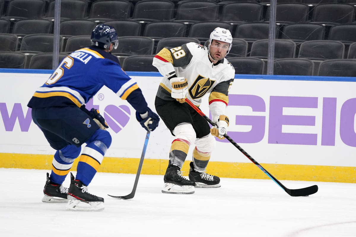 Vegas Golden Knights' William Carrier (28) brings the puck down the ice as St. Louis Blues' Mar ...