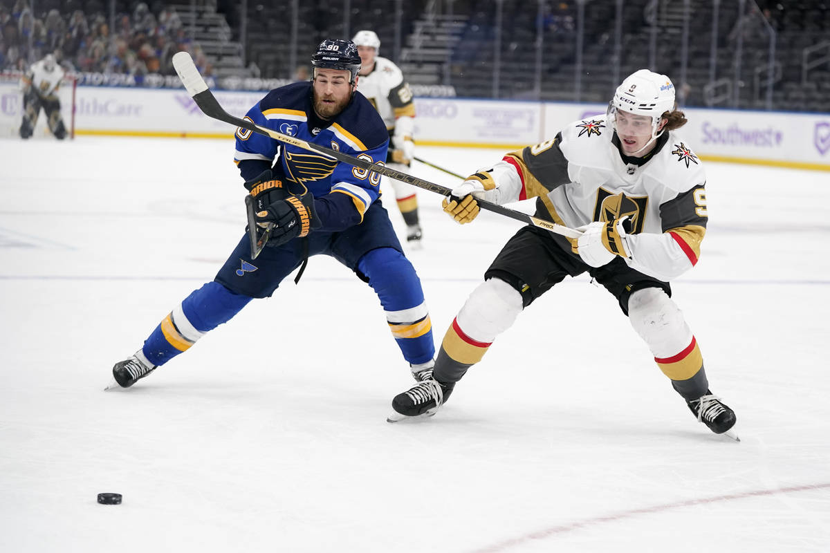 Vegas Golden Knights' Cody Glass (9) and St. Louis Blues' Ryan O'Reilly (90) chase after a loos ...