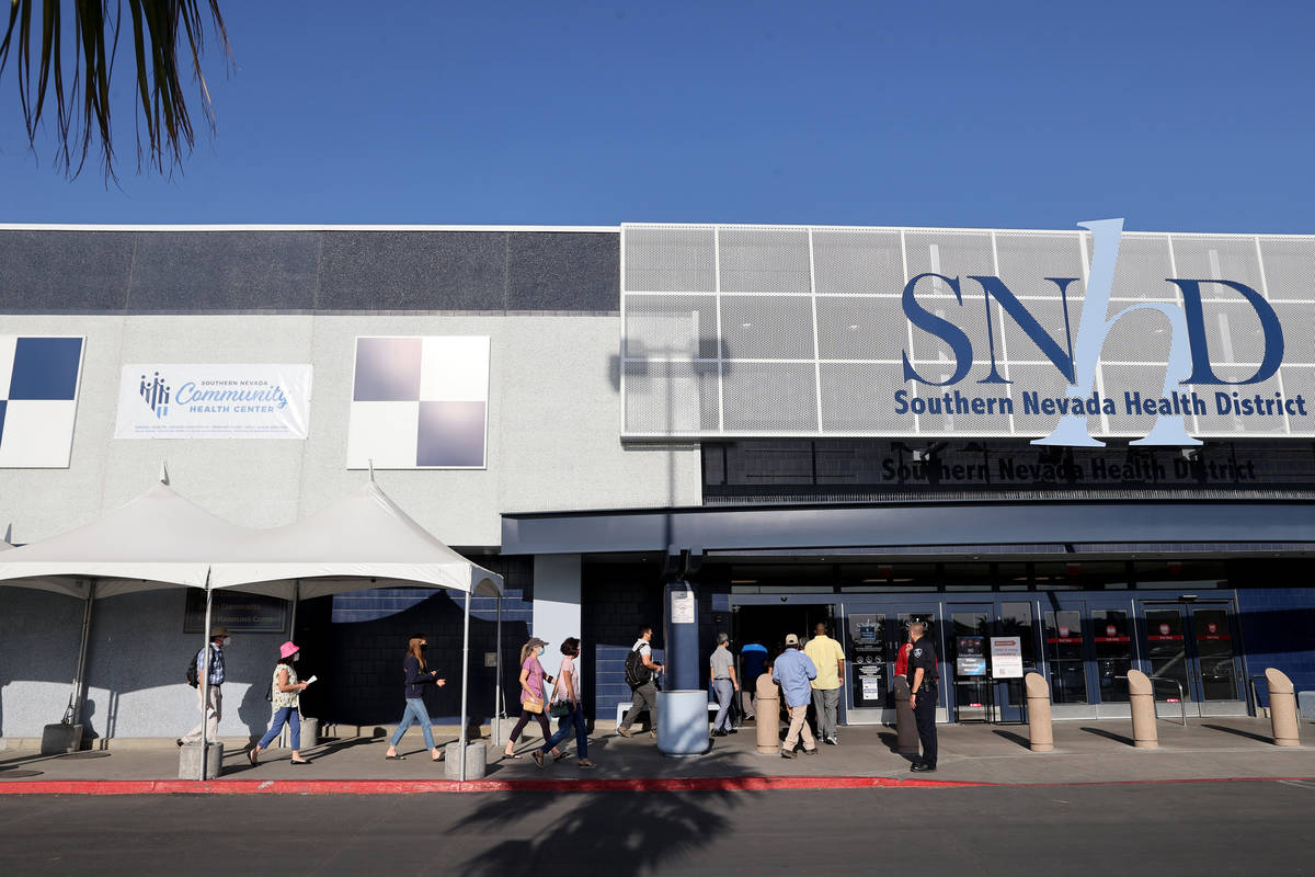 People line up for COVID-19 vaccinations at the Southern Nevada Health District site Monday, Ap ...