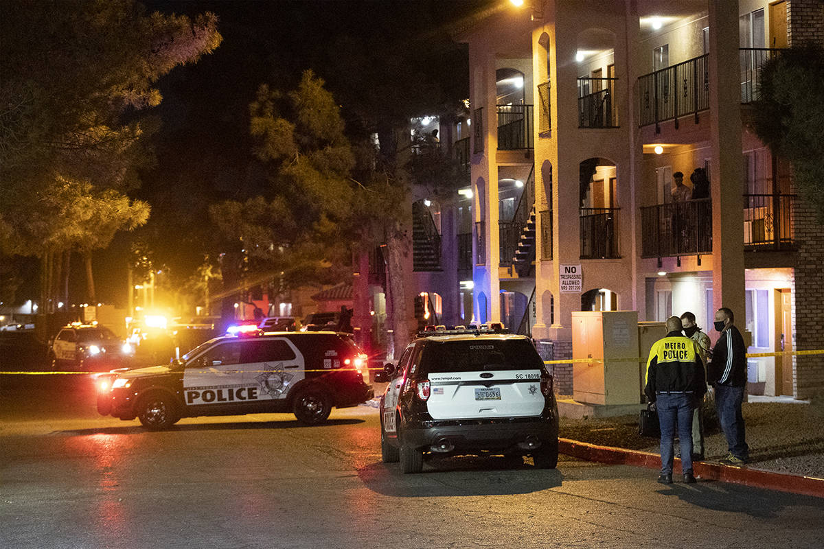 Las Vegas police investigate the scene of a homicide at the 3600 block of Paradise Road in Las ...
