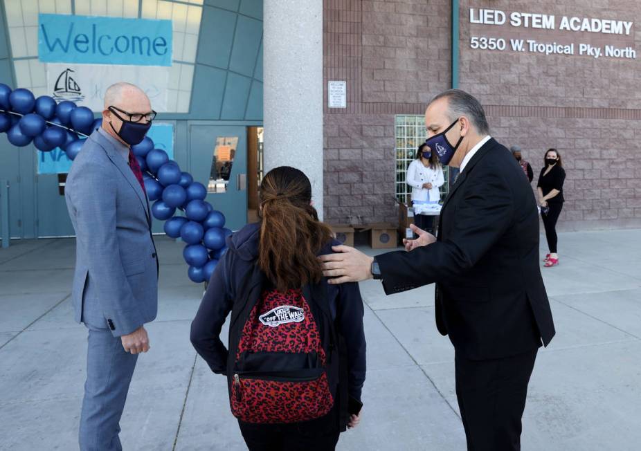 Superintendent Jesus Jara, right, and Principal Derek Fialkiewicz welcome students for their fi ...
