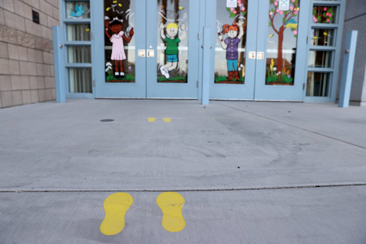 Social distancing foot prints at Neal STEAM Academy in Las Vegas Tuesday, April 6, 2021. After ...