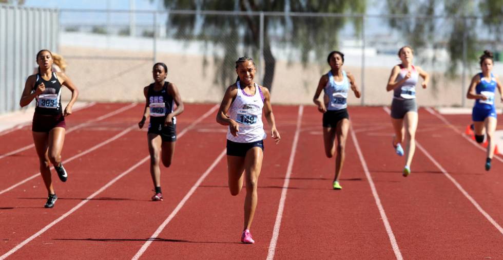 Kennedy Brace Centennial, third from left, on her way to winning the 400 meters in the state tr ...