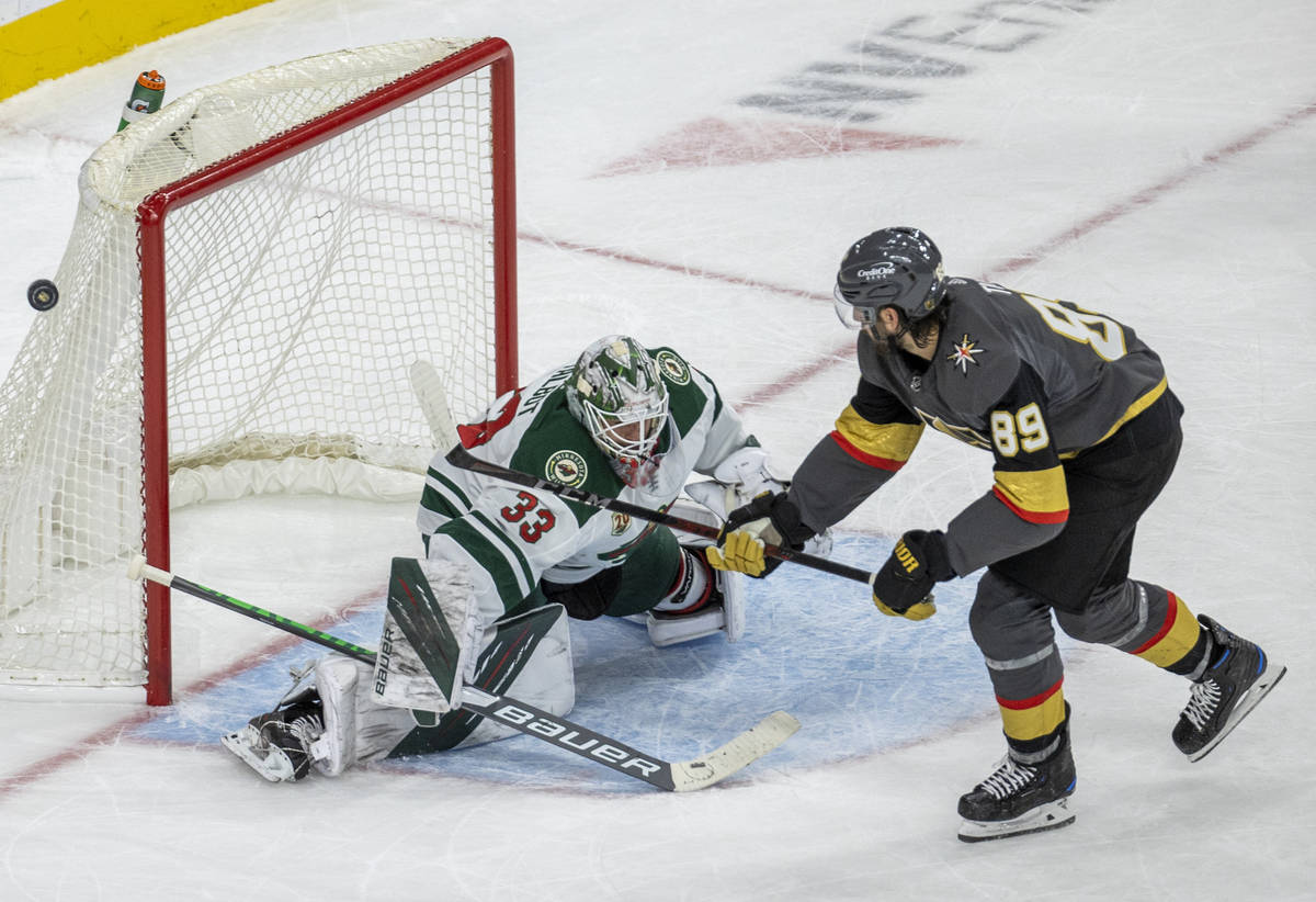 Golden Knights right wing Alex Tuch (89) is unable to score as Minnesota Wild goaltender Cam Ta ...