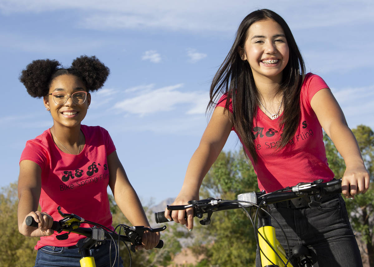 Bella Hawkins, 15, and Aiyana Castro, 12, at Radiant Ruby Park on Friday, April 9, 2021, in Las ...