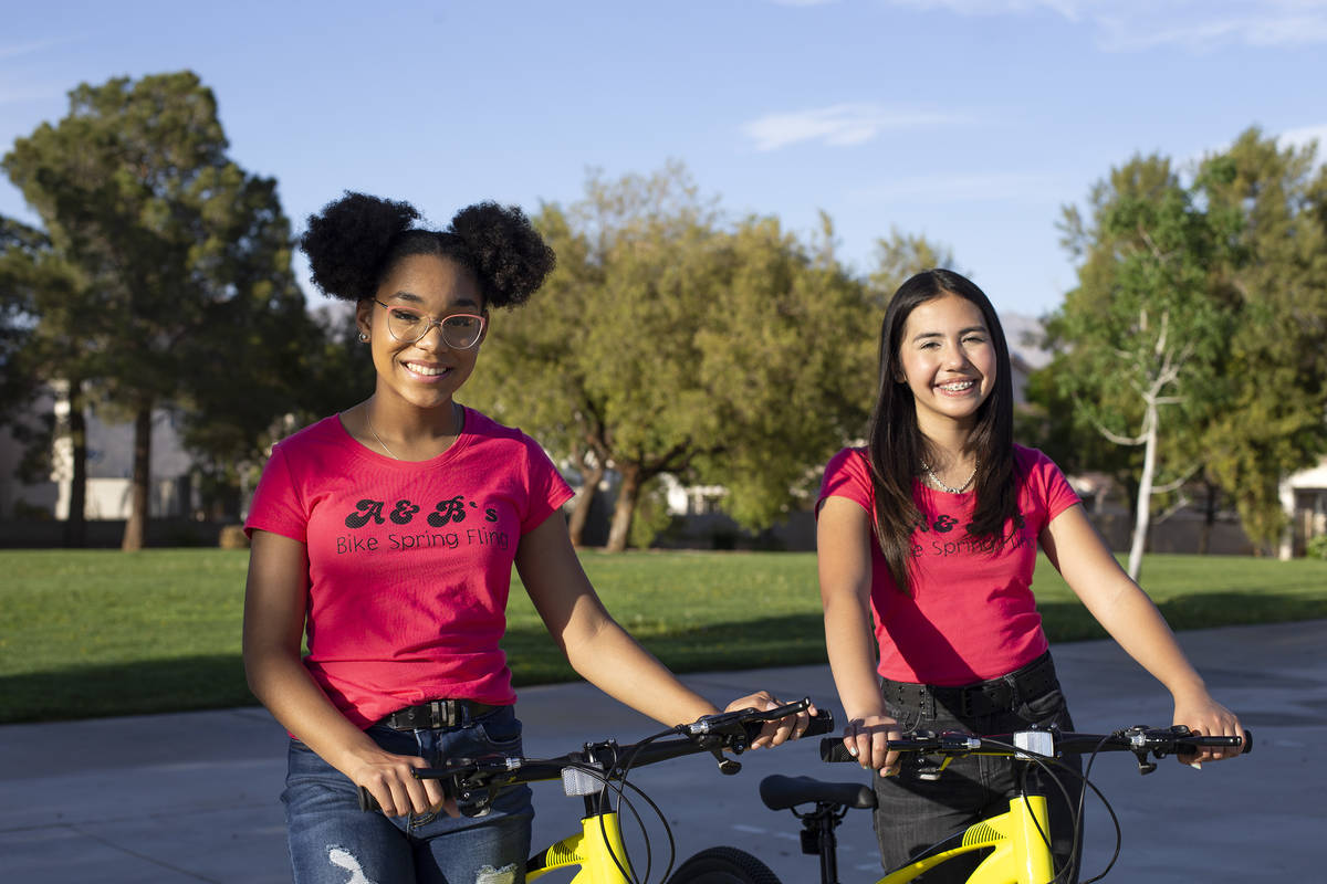 Bella Hawkins, 15, and Aiyana Castro, 12, at Radiant Ruby Park on Friday, April 9, 2021, in Las ...