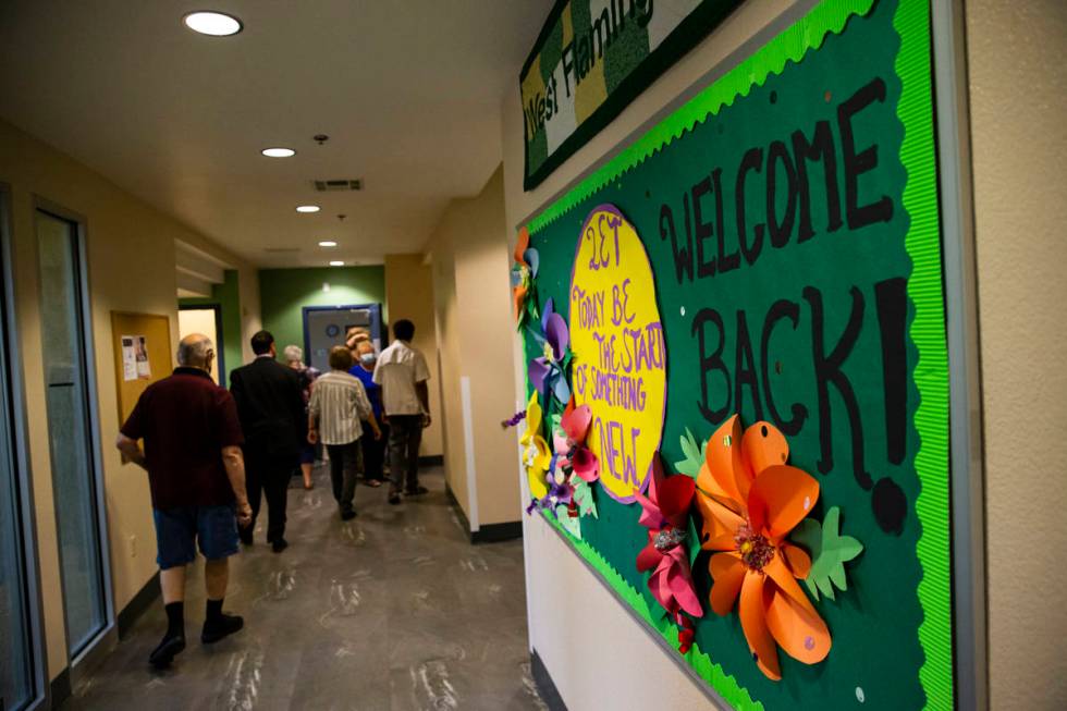 A sign welcomes people back at the West Flamingo Senior Center during the first day that Clark ...