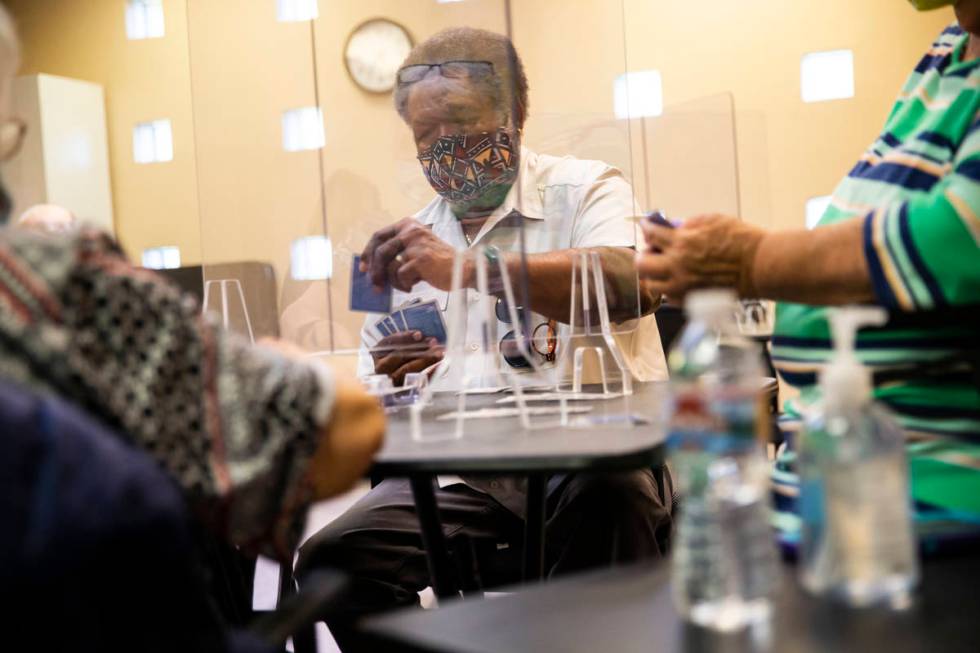 Gordon Dew plays the card game canasta at the West Flamingo Senior Center during the first day ...