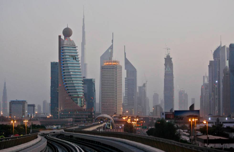 This Sept. 18, 2009 picture shows Burij Dubai, world's tallest tower under construction, center ...