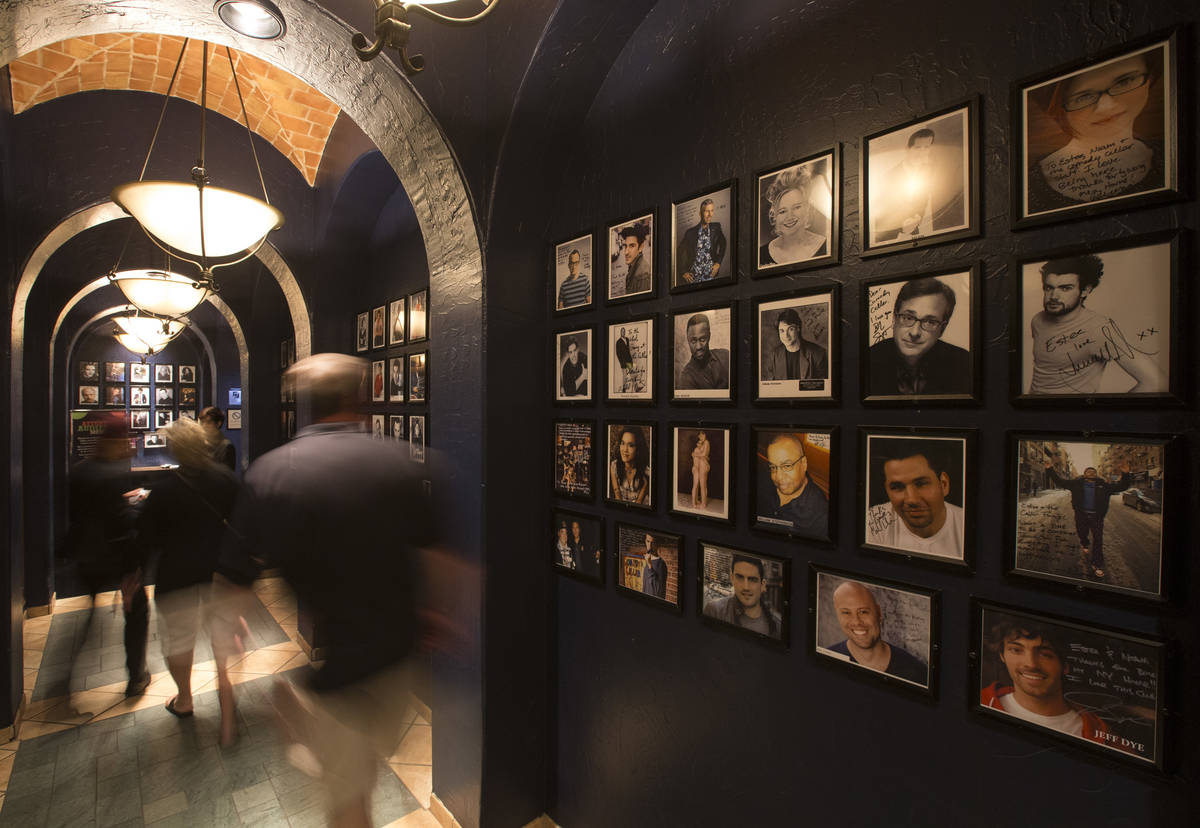 The walls of the entrance way to the Comedy Cellar are lined with headshots of famous comedians ...