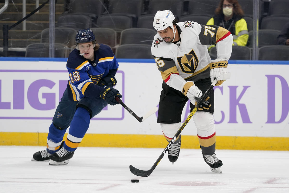 Vegas Golden Knights' Ryan Reaves (75) and St. Louis Blues' Robert Thomas (18) chase after a lo ...