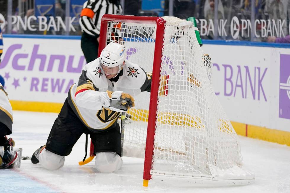 Vegas Golden Knights' Brayden McNabb slides into the net during the second period of an NHL hoc ...