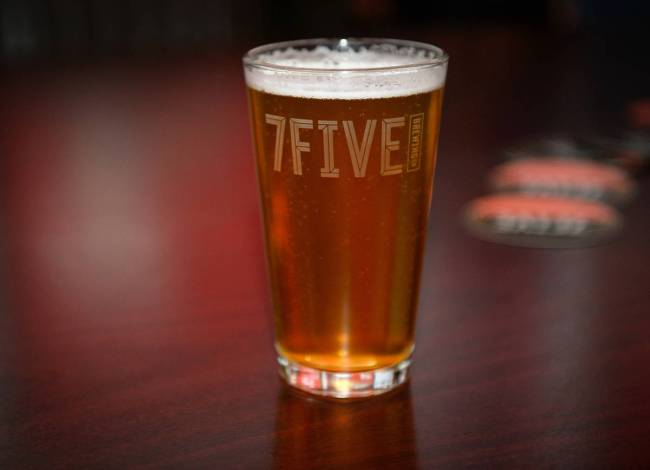 A glass of Vegas Golden Knights player Ryan Reaves' new beer, Training Day, sits on a table at ...
