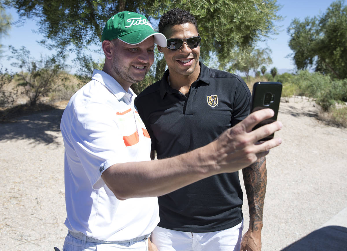 Vegas Golden Knights right wing Ryan Reaves, right, takes a selfie with Knights fan Harley Carb ...